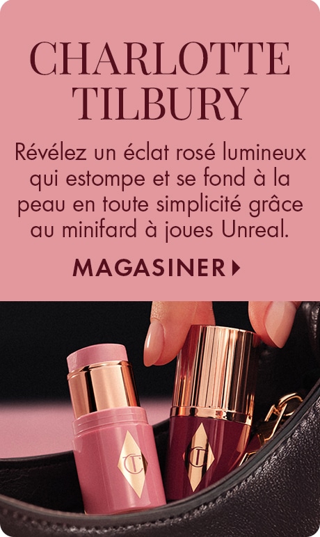 Fond rose poudré avec texte indiquant « Charlotte Tilbury » et « Affichez une touche de couleur éclatante qui s’estompe comme un charme grâce au minifard à joues Unreal » plus « Magasiner ». Deux fards à joues en bâton Charlotte Tilbury sont illustrés dans