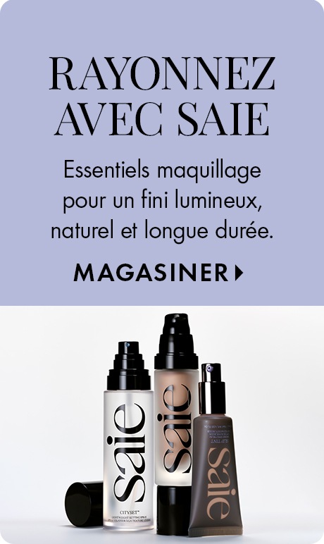Texte sur un arrière-plan lavande pâle : « Rayonnez avec Saie. Essentiels maquillage pour un fini lumineux, naturel et longue durée. Magasiner. » En dessous, trois essentiels Saie dans un élégant emballage noir et blanc, comprenant des flacons de fond de t