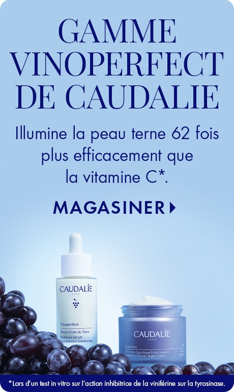 Fond bleu clair avec texte « Gamme Vinoperfect de Caudalie ». Ci-dessous : « Illumine la peau terne 62 fois plus efficacement que la vitamine C » avec « Magasiner ». Une bouteille de sérum Vinoperfect et un pot de crème sont placés parmi les raisins noirs.