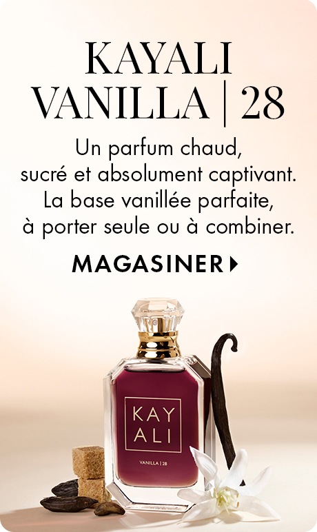 Fond beige neutre avec texte « Parfum Vanilla | 28 de Kayali » et « Chaud, sucré et absolument captivant. La base vanillée parfaite, à porter seule ou à combiner » suivi de « Magasiner ». Une bouteille de parfum Kayali au milieu de gousses de vanille, de f