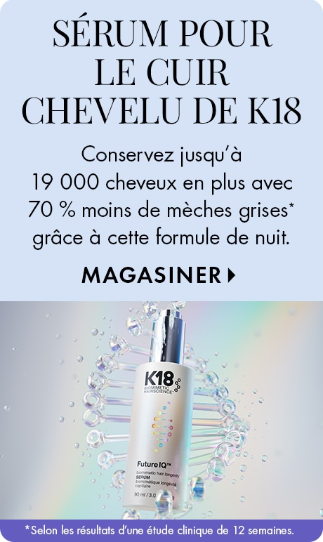 « SÉRUM POUR LE CUIR CHEVELU K18 » « Conservez jusqu’à 19 000 cheveux en plus avec 70 % moins de cheveux gris* avec cette formule de nuit. » Bannière « MAGASINER » bleu pâle avec une bouteille de sérum pour le cuir chevelu de K18 devant un motif inspiré de