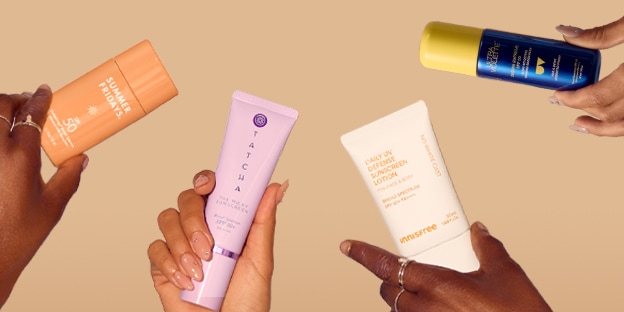 image of models holding spf products