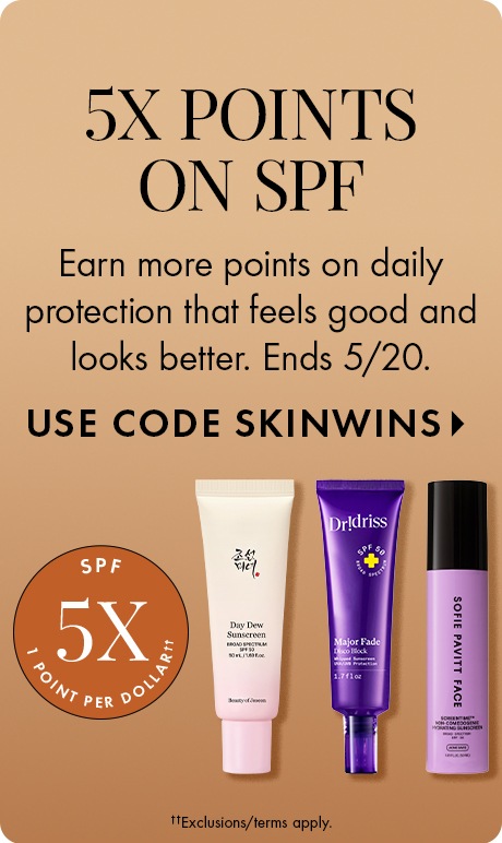 Warm tan gradient background with text reading “5X Points on SPF.” Smaller text says “Earn more points on daily protection that feels good and looks better. Ends 5/20,” and “Use code SKINWINS.” Three SPF products appear with an SPF 5X points badge.
