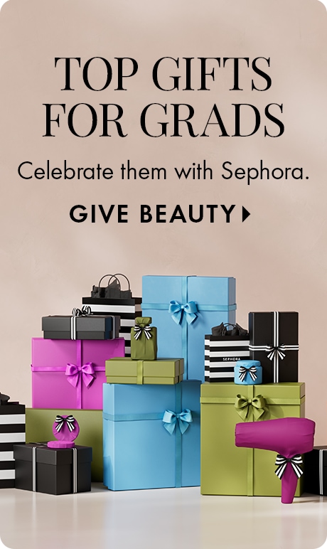 Beige background with text reading “Top Gifts for Grads” and “Celebrate them with Sephora,” followed by “Give Beauty.” A stack of colorful gift boxes and Sephora‑striped shopping bags with ribbon bows is arranged at the bottom.