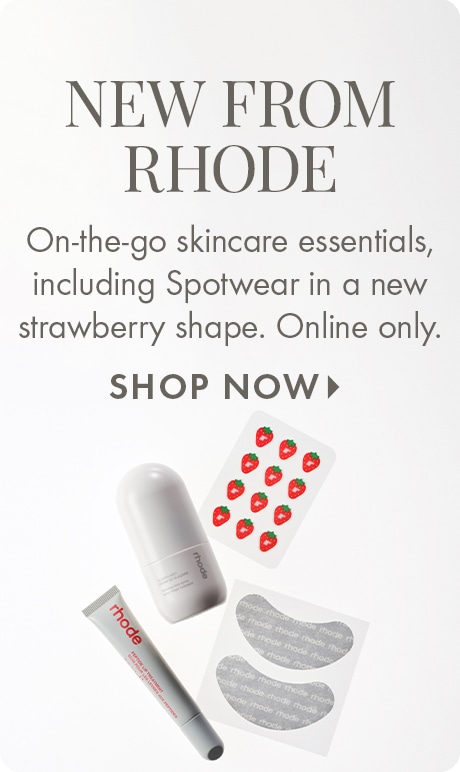 "NEW FROM RHODE" "On-the-go skincare essentials, including Spotwear in a new strawberry shape. Online only." "SHOP NOW" Rhode skincare featuring a tube, cylindrical container, strawberry-shaped spot patches, and under-eye gel patches on a light background.