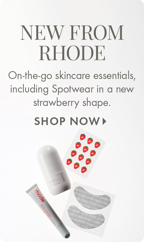 "NEW FROM RHODE" "On-the-go skincare essentials, including Spotwear in a new strawberry shape." "SHOP NOW" Rhode skincare featuring a tube, cylindrical container, strawberry-shaped spot patches, and under-eye gel patches on a light background.