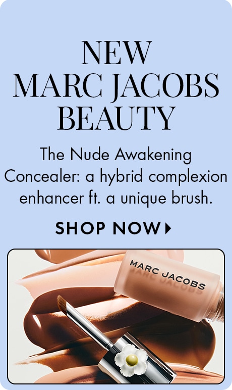 "NEW MARC JACOBS BEAUTY" "The Nude Awakening Concealer: a hybrid complexion enhancer ft. a unique brush." "SHOP NOW" Beauty ad on a light blue background featuring a Marc Jacobs concealer tube and applicator brush over creamy makeup swatches.