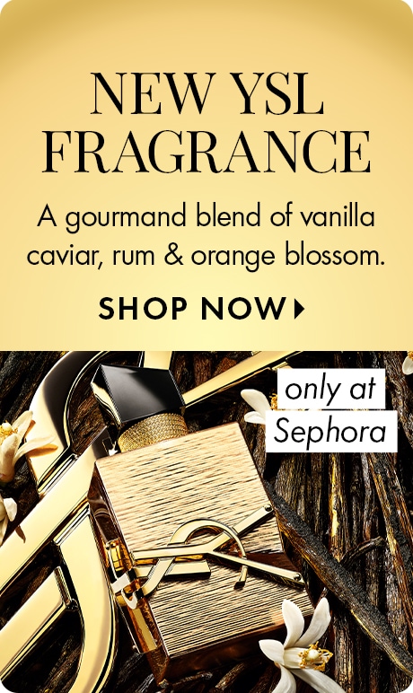 "NEW YSL FRAGRANCE" "A gourmand blend of vanilla caviar, rum & orange blossom." "SHOP NOW" Beauty ad with a gold background featuring a gold YSL perfume bottle among vanilla beans and white blossoms, plus a label reading “only at Sephora.”