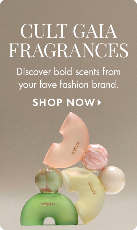 "CULT GAIA FRAGRANCES" "Discover bold scents from your fave fashion brand." "SHOP NOW" Three sculptural Cult Gaia fragrance bottles in green, blush, and pale yellow are stacked with marble-like spheres against a neutral beige background.