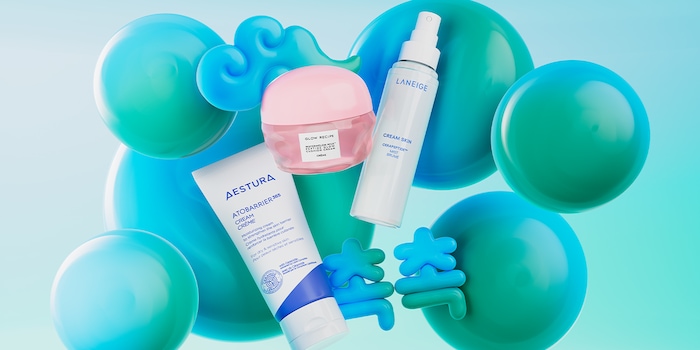 AESTURA Atobarrier Cream tube, pink moisturizer jar, and LANEIGE Cream Skin spray bottle float among glossy teal and blue bubble shapes on a pale blue background, with small blue decorative symbols and a cloud motif near the top.
