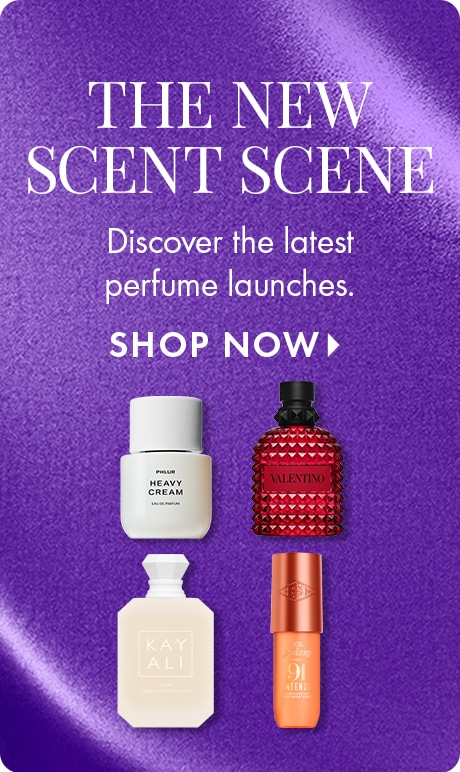 “THE NEW SCENT SCENE. Discover the latest perfume launches. SHOP NOW.” Purple textured background with four fragrance bottles in white, red, cream, and orange.