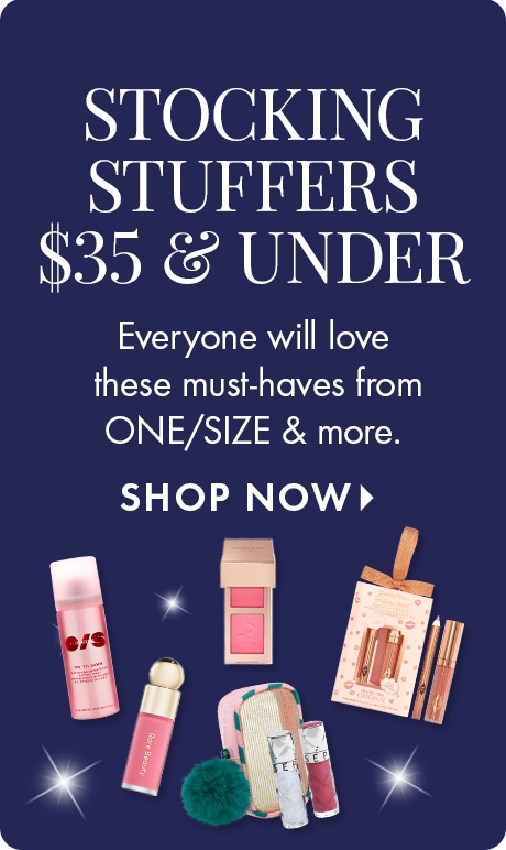 Image with dark blue background promoting stocking stuffers $35 and under. Text reads: “Everyone will love these must-haves from ONE/SIZE & more.” Includes beauty items like a spray bottle, compact, and festive lip product gift set.