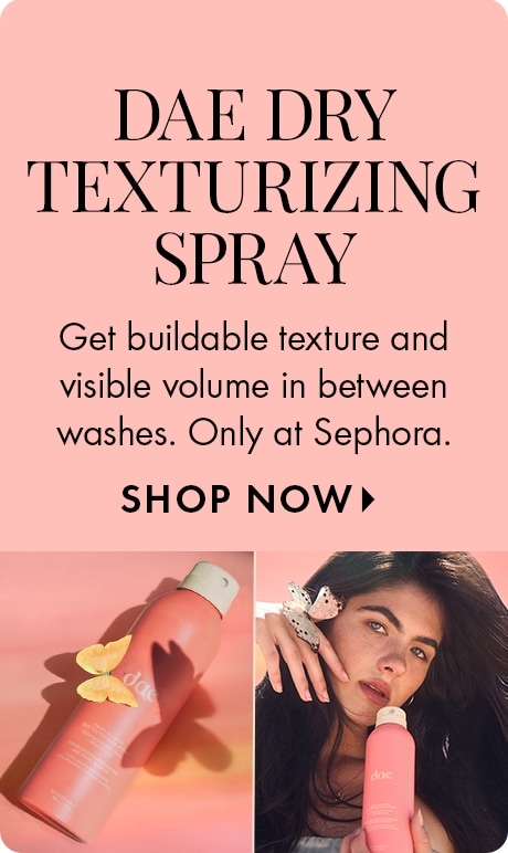 Pink background with text: “DAE DRY TEXTURIZING SPRAY. Get buildable texture and visible volume in between washes. Only at Sephora.” Below are images of a pink Dae texturizing spray bottle, one lying on a surface with butterflies and one being held.