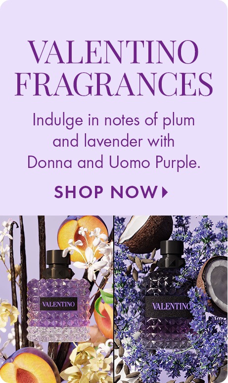 Light purple background with text: “Valentino Fragrances. Indulge in notes of plum and lavender with Donna and Uomo Purple. Shop Now.” Below are two Valentino perfume bottles surrounded by plum slices, flowers, and lavender.