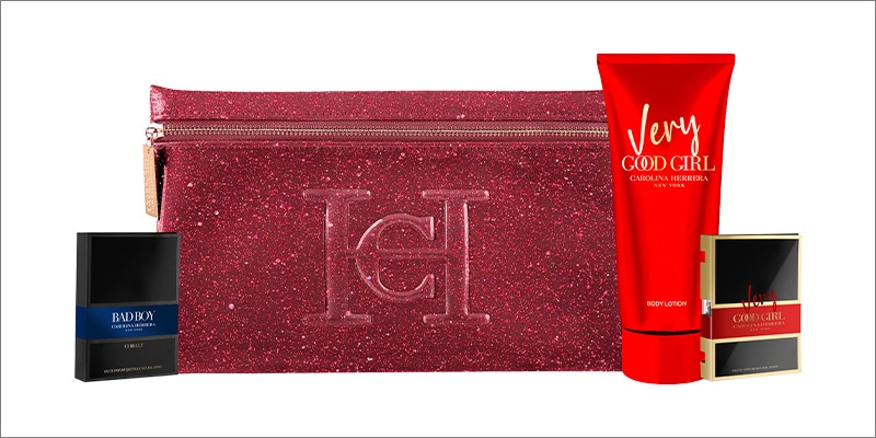 Carolina Herrera fragrance set featuring Bad Boy Cobalt Eau de Parfum, Very Good Girl Eau de Parfum, and a matching body lotion, arranged with a branded glitter pouch.