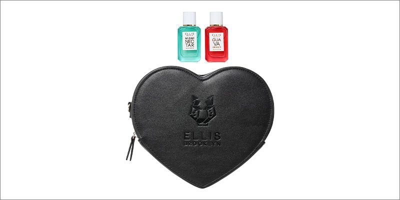A black, heart-shaped Ellis Brooklyn pouch with an embossed logo, shown below two Ellis Brooklyn mini fragrance bottles with turquoise and coral labels on a white background. Provide your feedback on BizChat