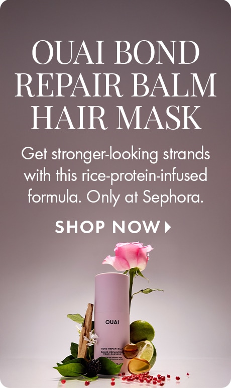 Muted mauve background with text reading “Ouai Bond Repair Balm Hair Mask.” Below: “Get stronger-looking strands with this rice-protein-infused formula. Only at Sephora.” An Ouai hair mask bottle is shown with a pink rose and natural elements.
