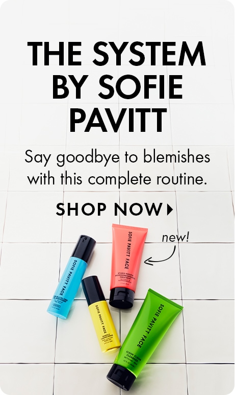 White tiled background with text reading “The System by Sofie Pavitt” and “Say goodbye to blemishes with this complete routine,” plus “Shop Now.” Four colorful Sofie Pavitt Face skincare products are arranged below, with one labeled “new!”