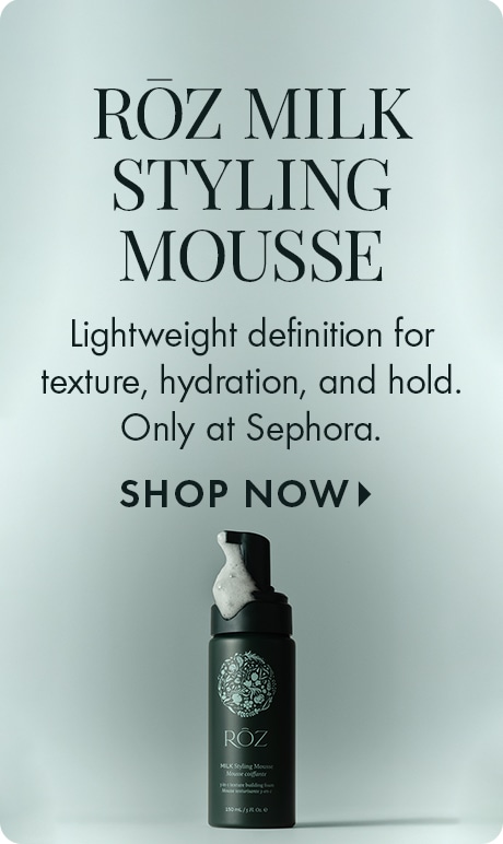 "RŌZ MILK STYLING MOUSSE" "Lightweight definition for texture, hydration, and hold. Only at Sephora." "SHOP NOW" A dark foaming mousse bottle with a floral RŌZ logo and product label is centered against a light gray background.