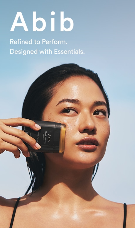 Abib. refined to perform. designed with essentials. image of model holding product.