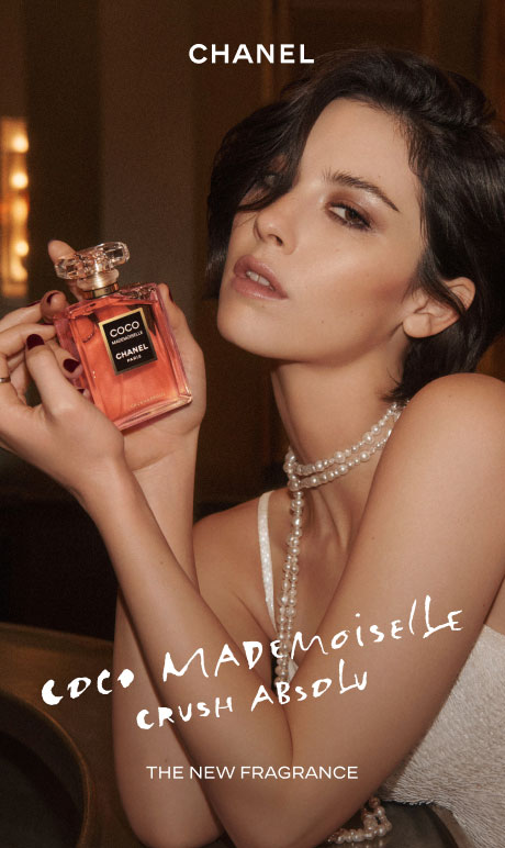 Chanel. coco mademoiselle crush absolu. the new fragrance. image of model holding bottle.