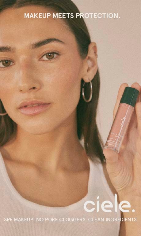 Makeup meets protection. ciele. spf makeup. no pore cloggers. clean ingredients. Image of model holding product.