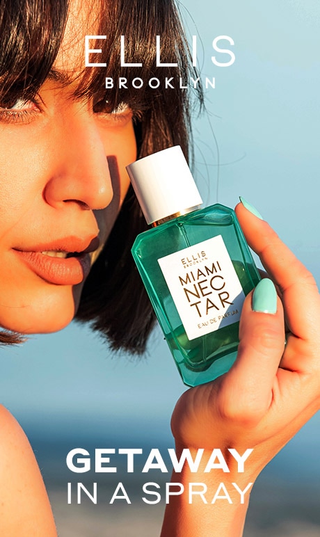 Ellis Brooklyn. Getaway in a spray. Image of model with fragrance bottle.