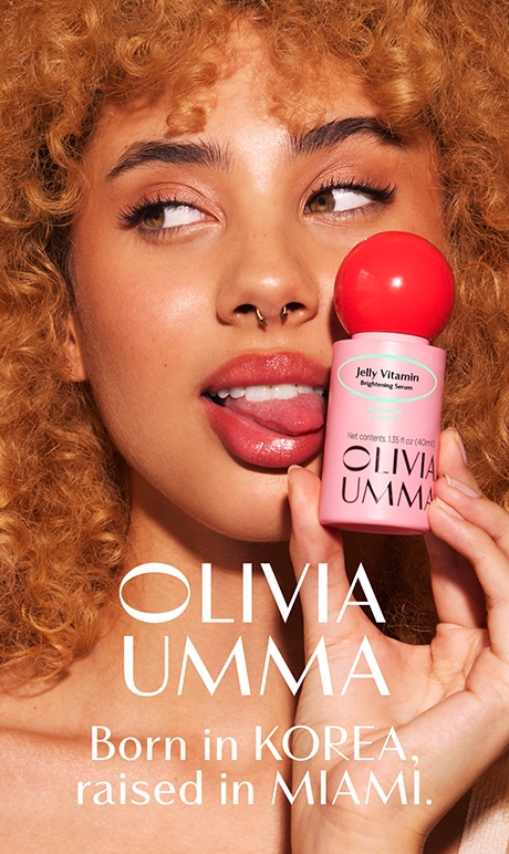 OLIVIAUMMA. born in korea raised in miami. image of model holding product.