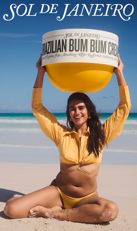 Sol De Janerio. Image of model holding product bottle.