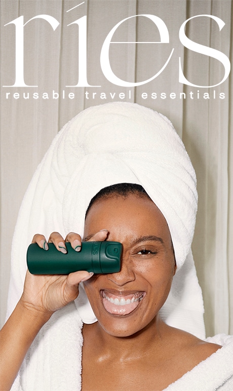 ries. reusable travel essentials. image of model holding product. 