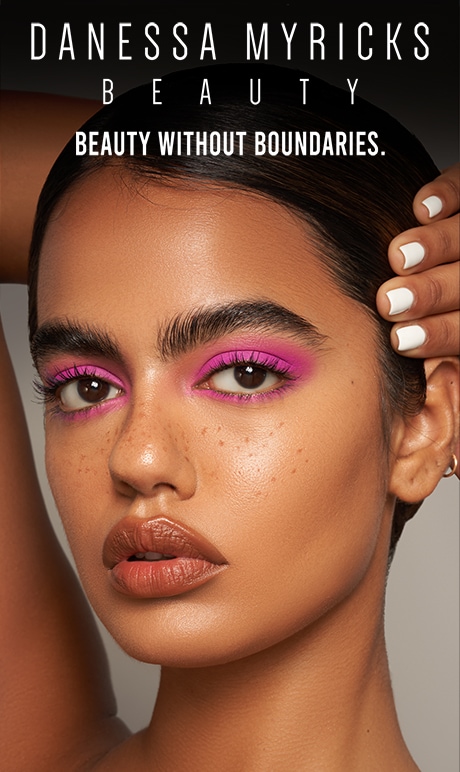 Danessa Myricks Beauty. Beauty without boundries | model wearing bright pink eyeshadow and brown nude lipstick