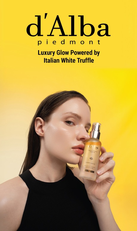d'alba peidmont. luxury glow powered by italian white truffle. image of model holding product.