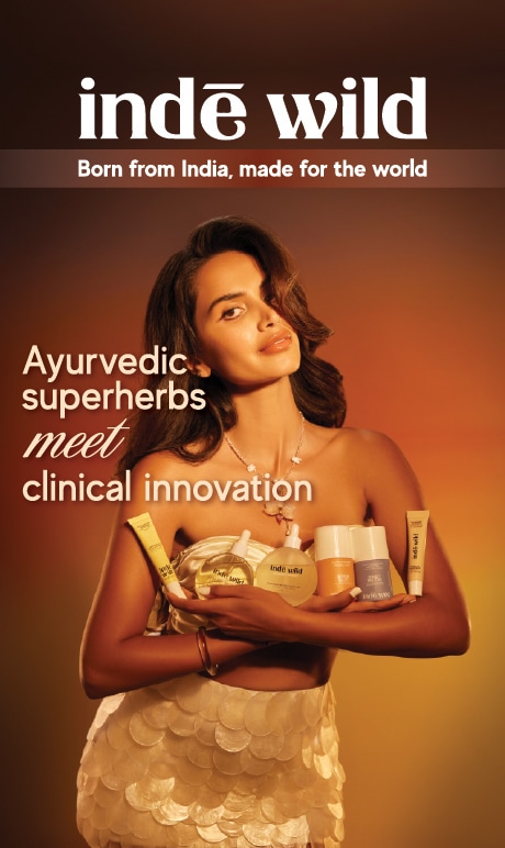 inde wild. born from india made for the world. image of model holding products. ayurvedic super herbs meet clinical innovation.