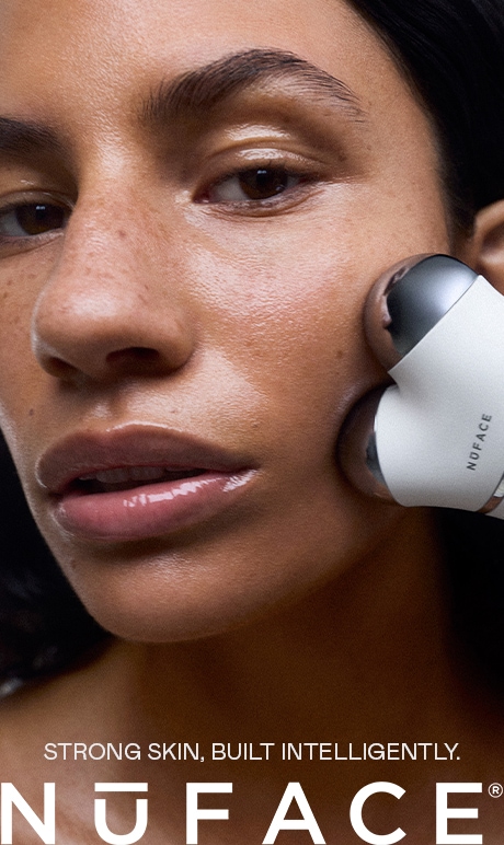 Nuface. Strong skin built intelligently. image of model holding product.
