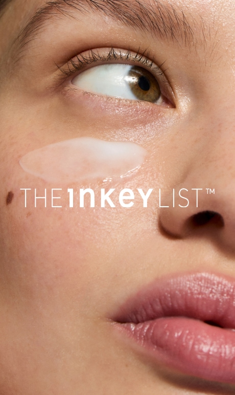 the inkey list. image of model with product.
