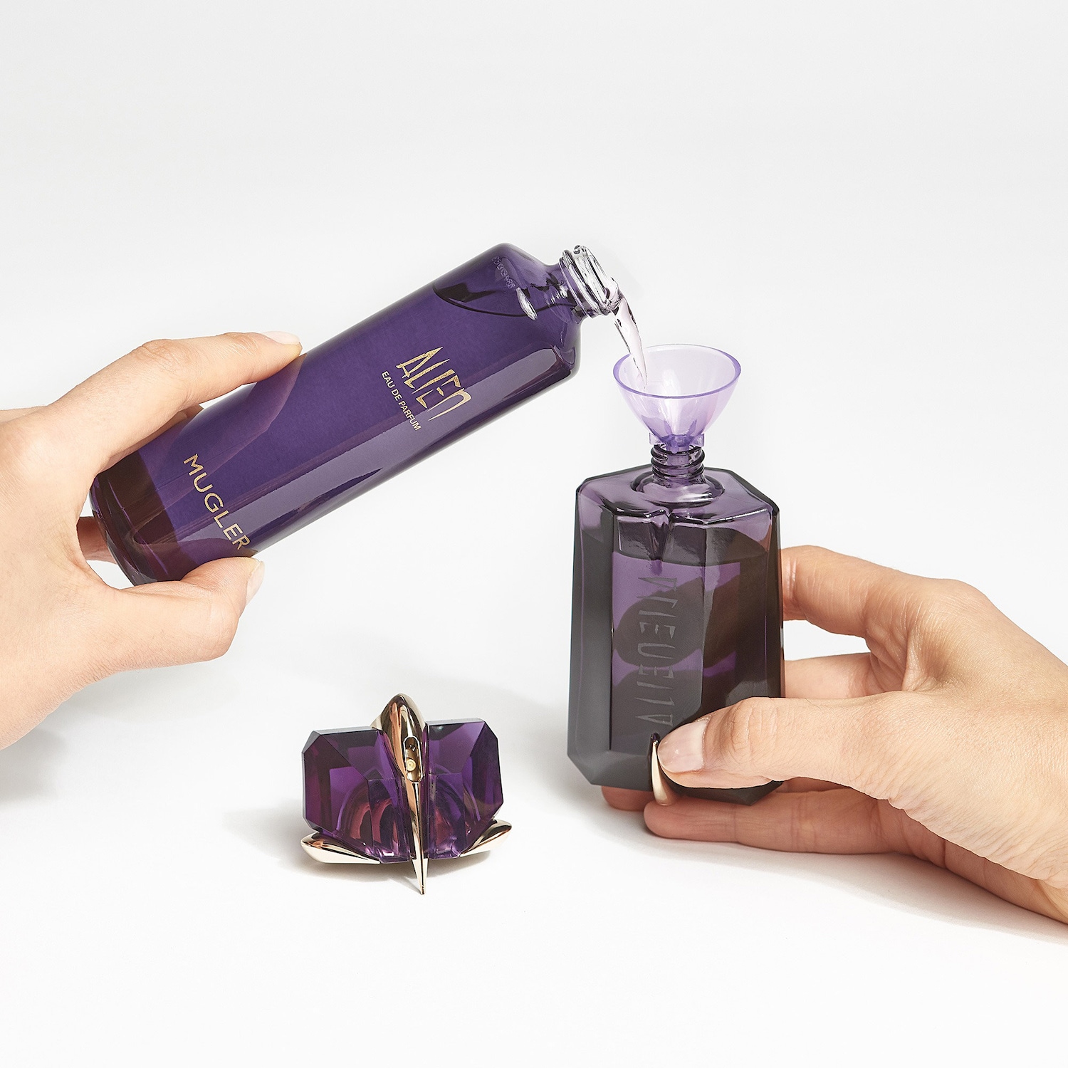 alien perfume purple bottle