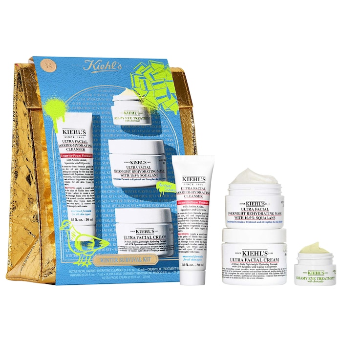 A blue box with four skincare products in front of it