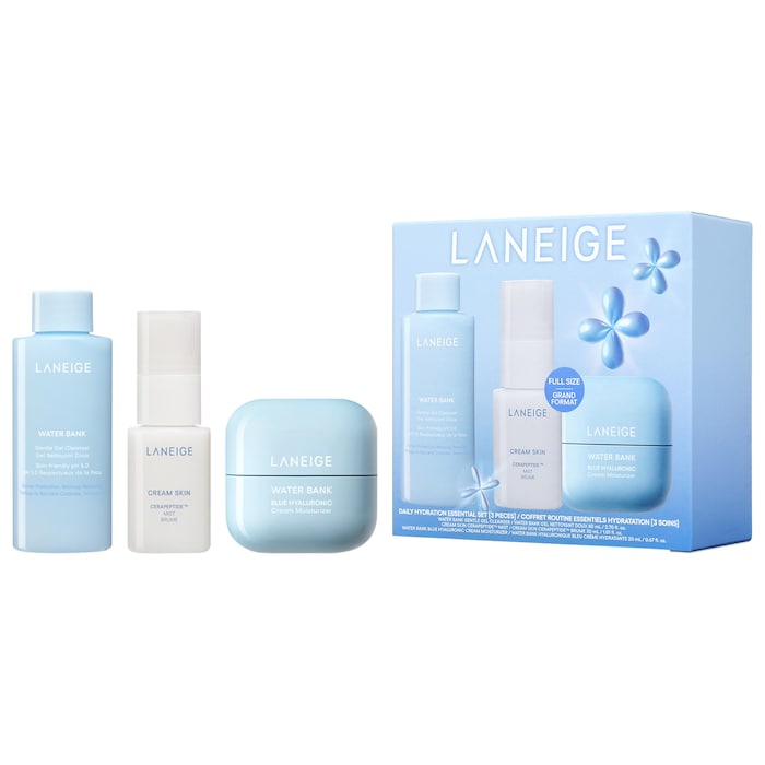 Three skincare products next to a blue box